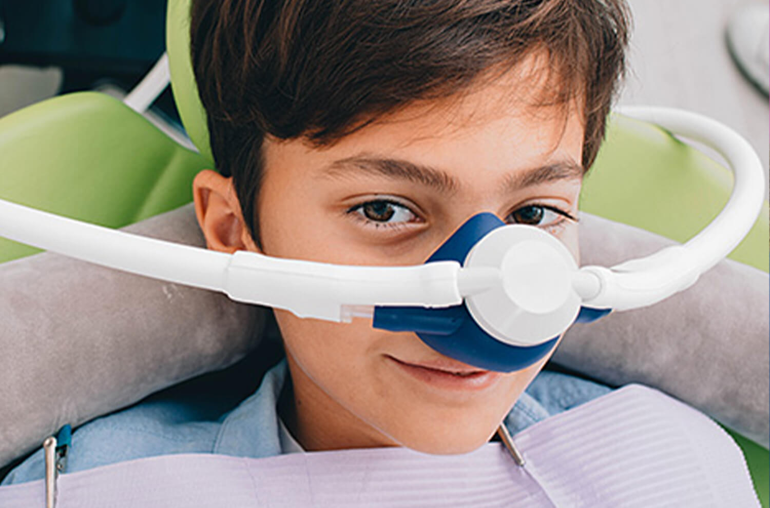 young boy wearing a sedation mask