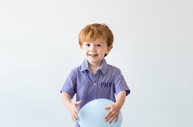 child holding balloon